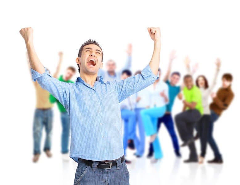 Group of happy people hugging and cheering